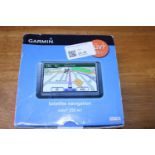 A boxed Garmin sat nav