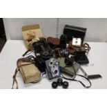 A job lot of assorted vintage cameras and accessories