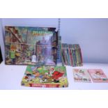 A selection of vintage children's games and books