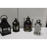 Four assorted candle lanterns