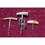 Three horn handled corkscrews