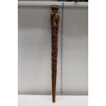 A finely carved African walking stick, postage unavailable