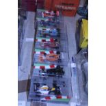 Seven boxed die-cast formula one models