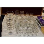 A job lot of vintage advertising glassware including Babycham glasses, shipping unavailable