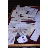 A job lot of assorted ephemera including stamps and collectors cards