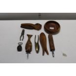 A job lot of treen including nut crackers and bottle openers