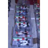 Seven boxed die-cast formula one models