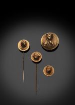 FOUR FINELY CHASED GOLD COINS WITH GIRLS' BUSTS