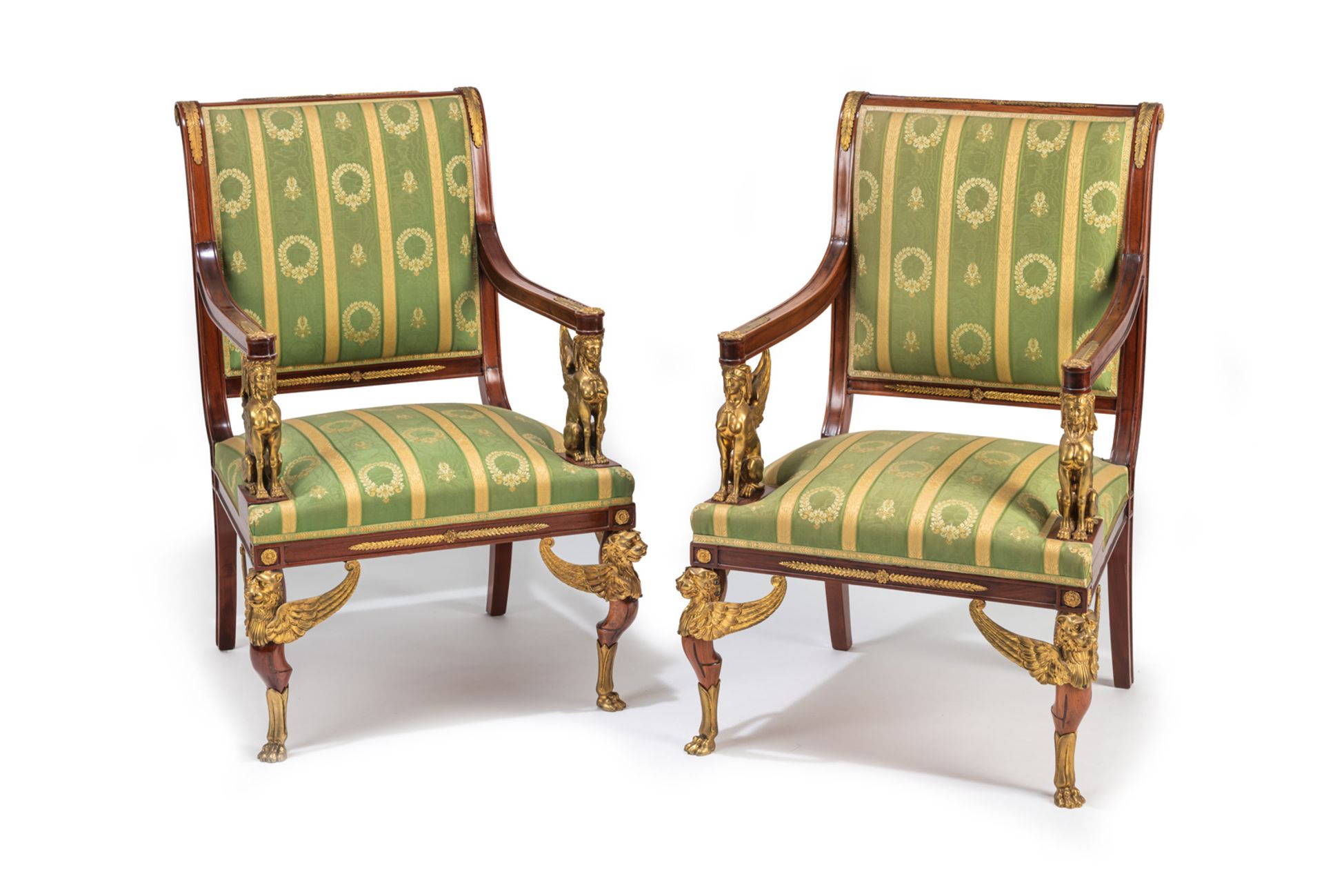 A PAIR OF NEOCLASSICAL ORMOLU MOUNTED MAHOGANY FAUTEUILS WITH SPHINX