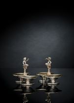A PAIR OF FRENCH PARCEL GILT SILVER SPICE STANDS WITH PUTTI