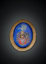 AN ENAMELLED COPPER PLAQUE WITH A COAT OF ARMS
