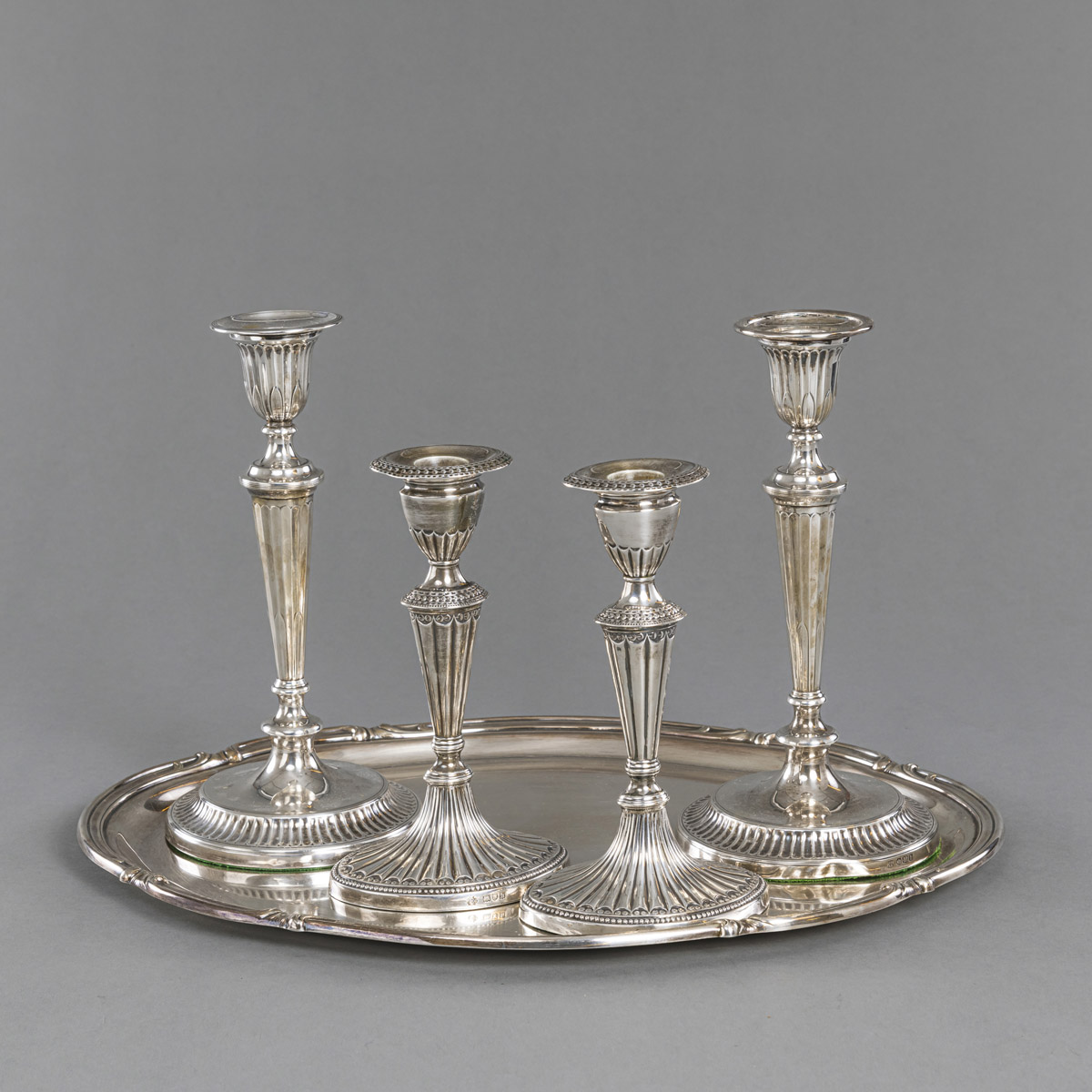 TWO PAIR OF LONDON SILVER CANDLESTICKS AND A GERMAN TRAY