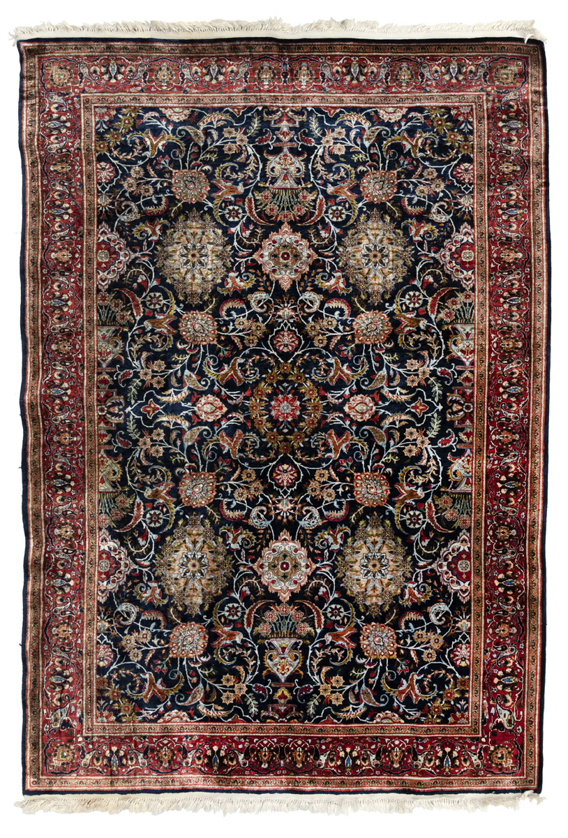 AN ALL OVER PATTERNED SILK RUG