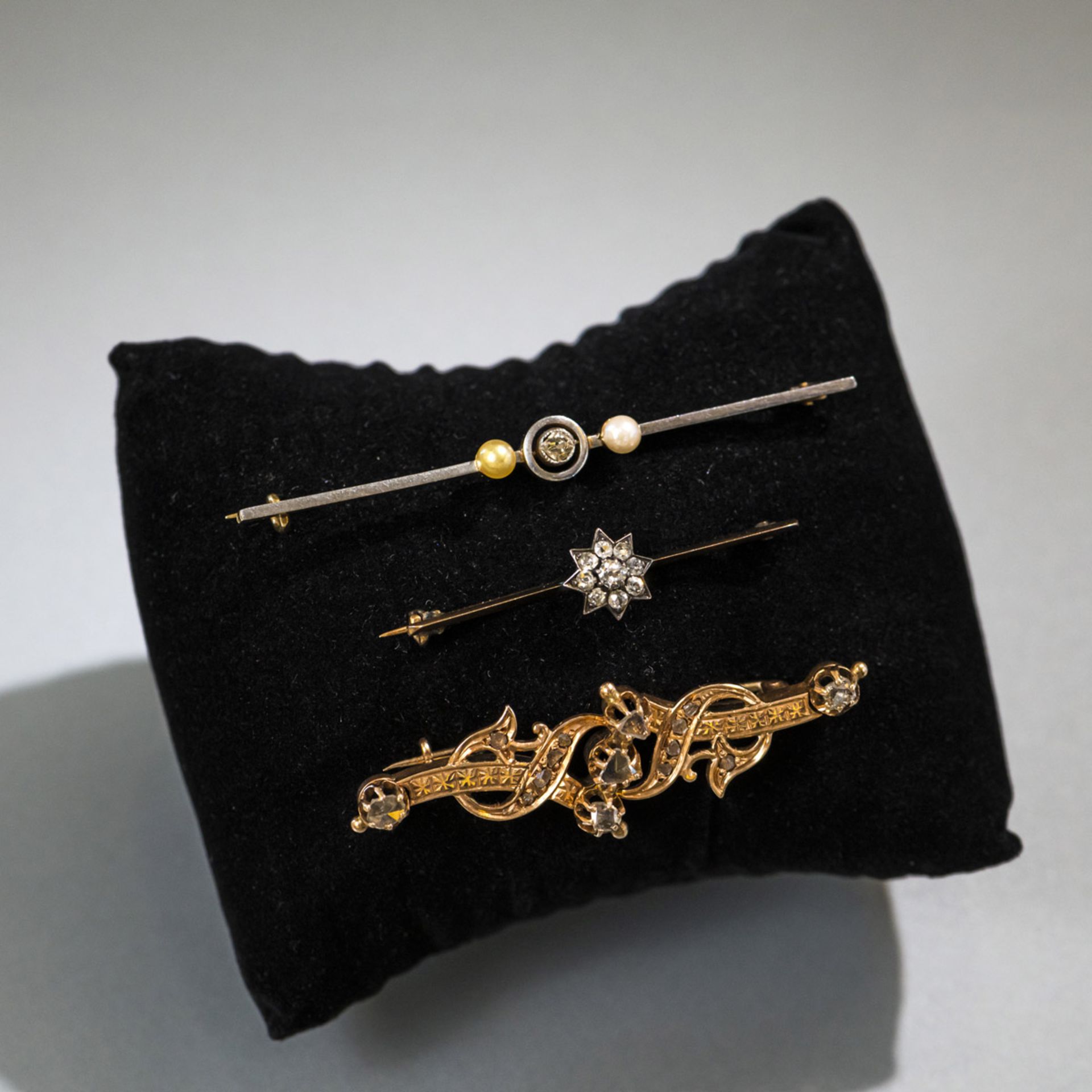 THREE GOLD BROOCHES