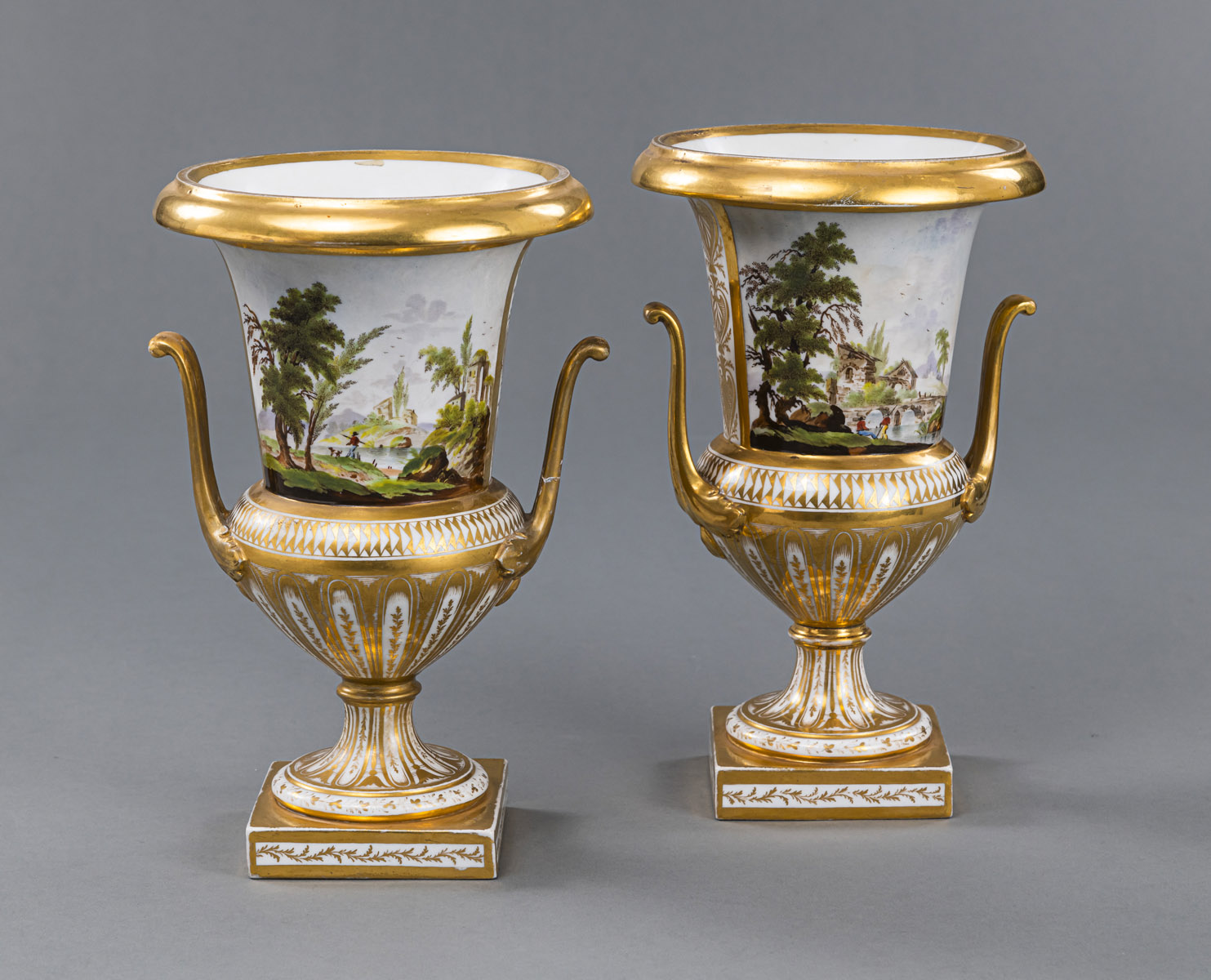 A PAIR OF LANDSCAPE PATTERN AND GILT MEDICI VASES