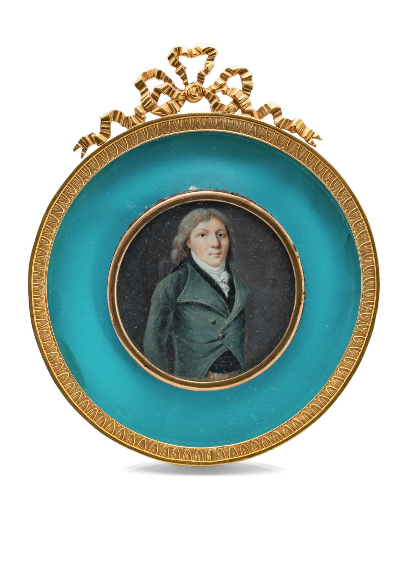 A MINIATURE PORTRAIT OF A JOUNG GENTLEMAN WEARIN A FROCK COAT