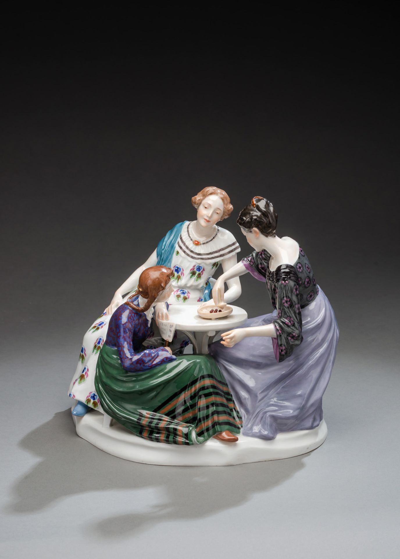 THREE YOUNG WOMEN PLAYING ROULETTE