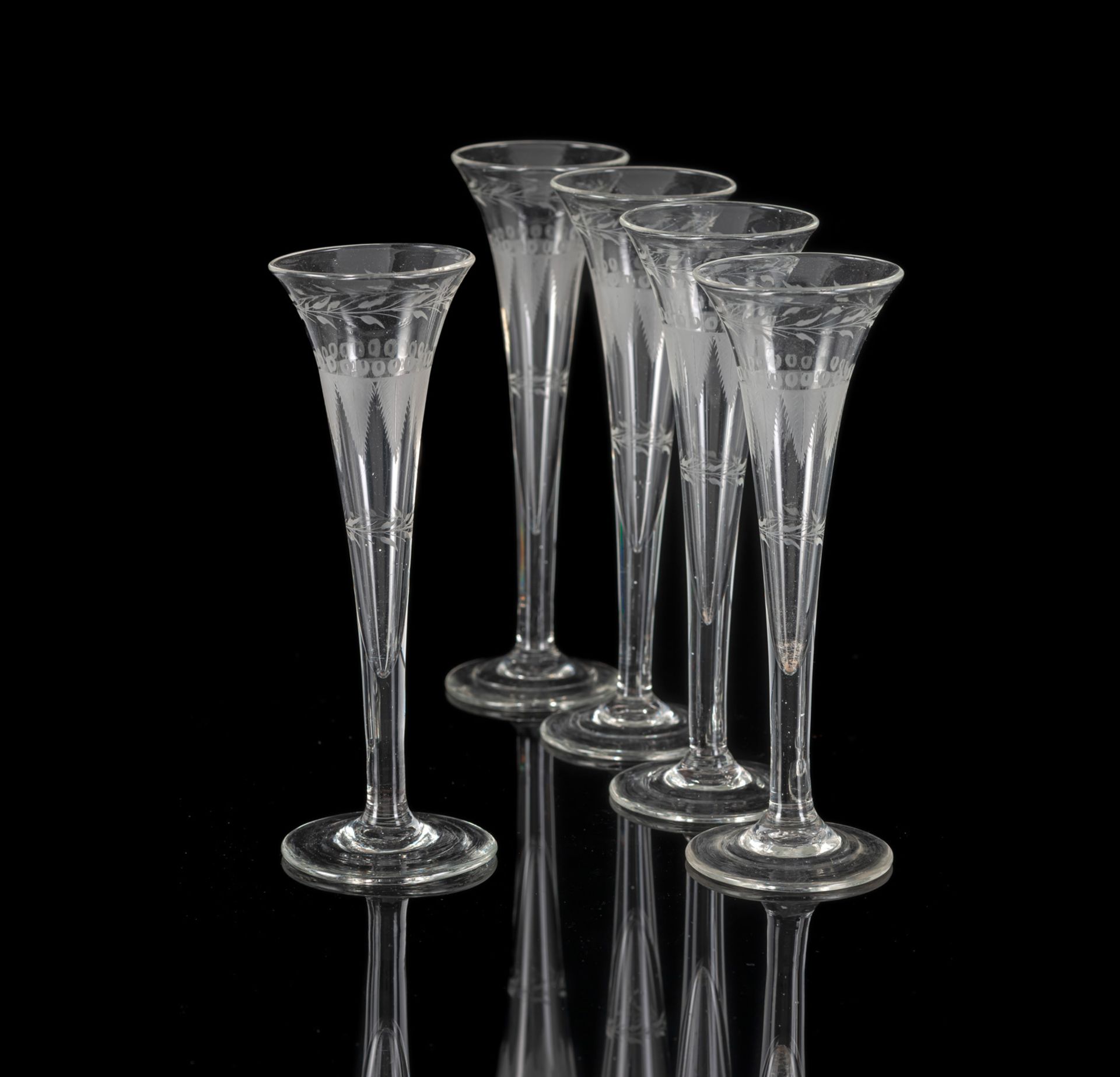 A SET OF FIVE EMPIRE SPARKLING WINE GLASSES