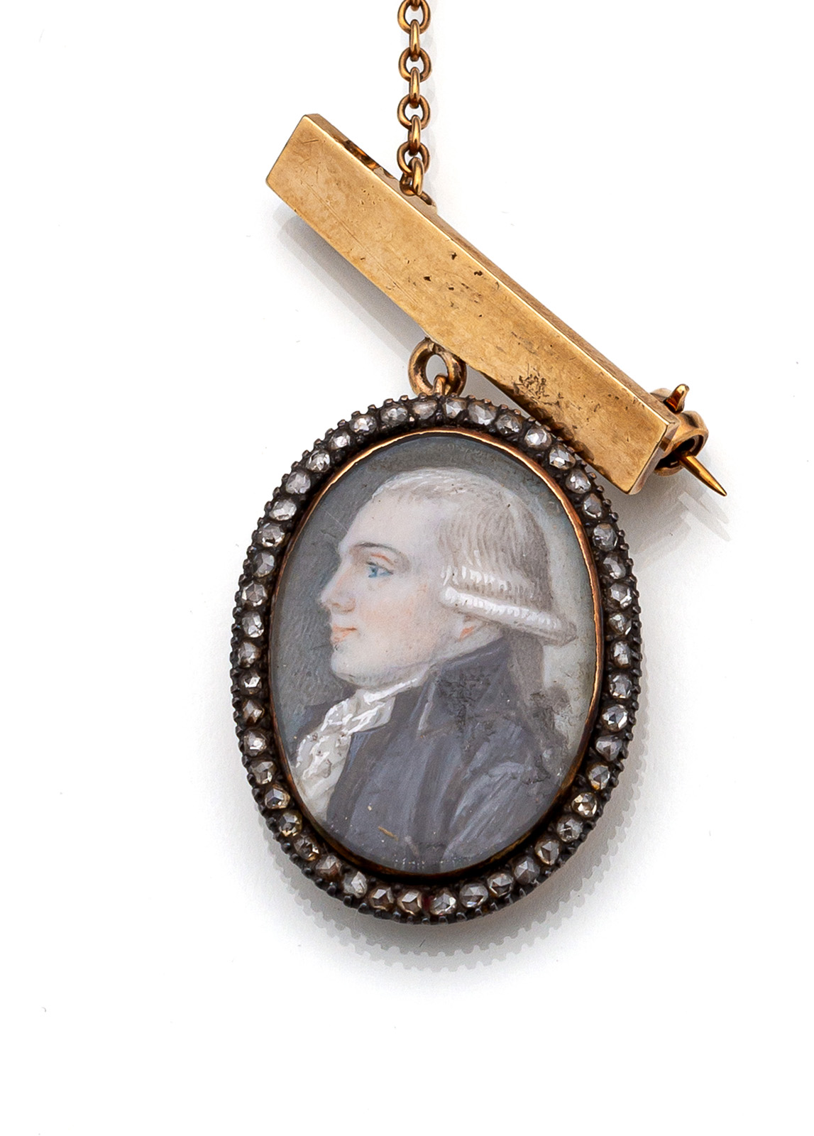 A SILVER AND GOLD PENDANT WITH A MINIATURE OF A YOUNG MAN WITH BLUE FROCK COAT