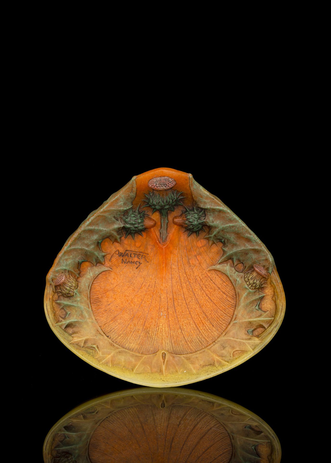 A PATE-DE-VERRE THISTLE PATTERN DISH BY HENRI BERGÉ