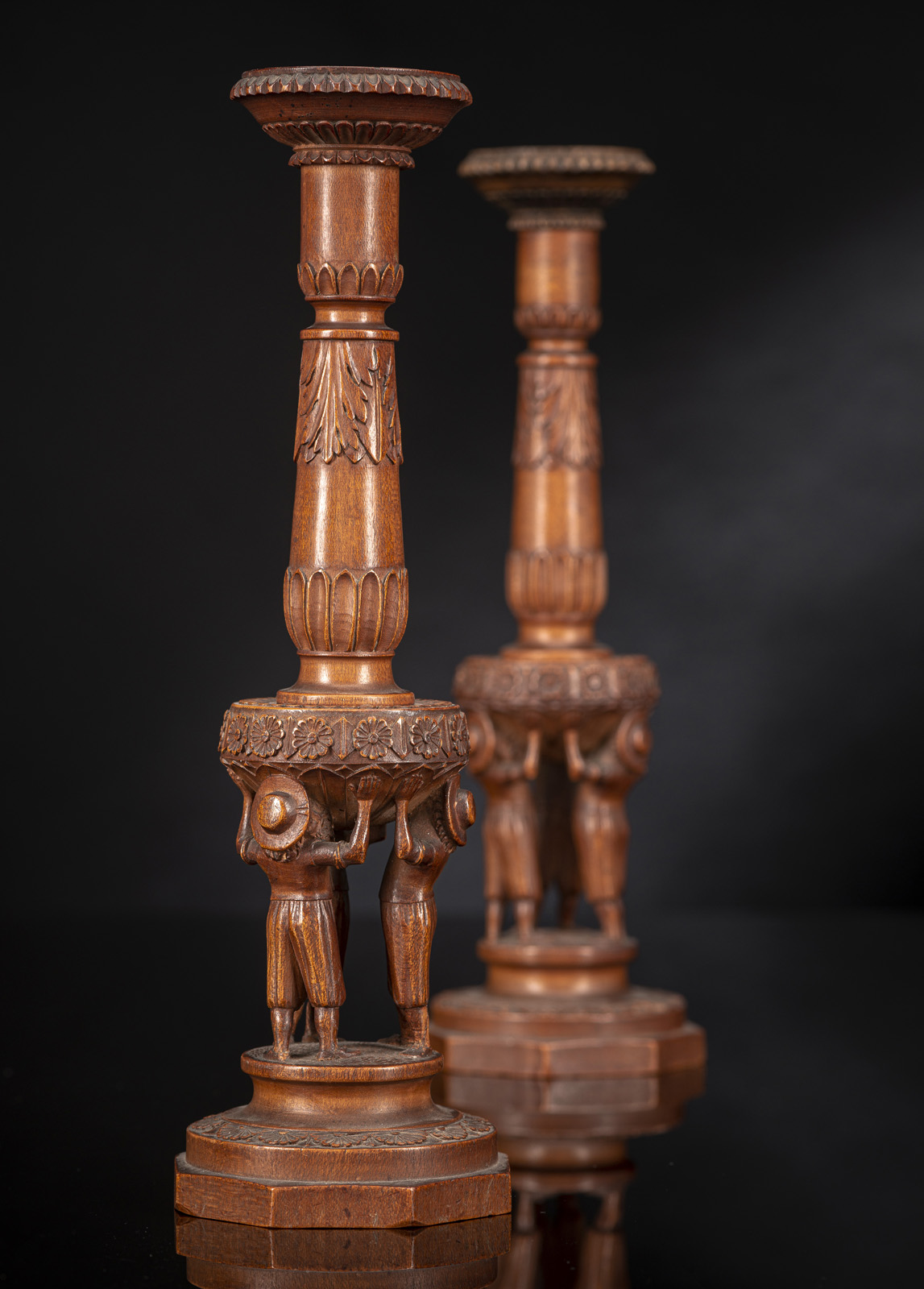 A PAIR OF FIGURAL CARVED FRUITWOOD CANDLESTICKS - Image 2 of 2