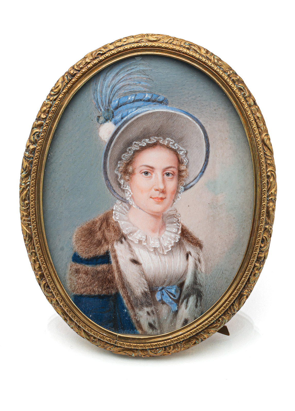 A PORTRAIT MINIATURE OF A YOUNG LADY WITH FUR COAT