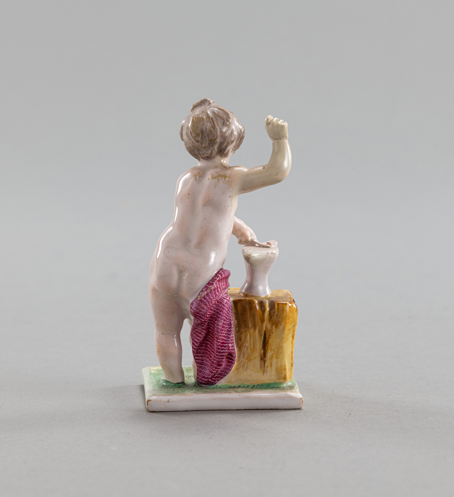 A CONTINENTAL FAYENCE FIGURE OF CUPID - Image 2 of 4