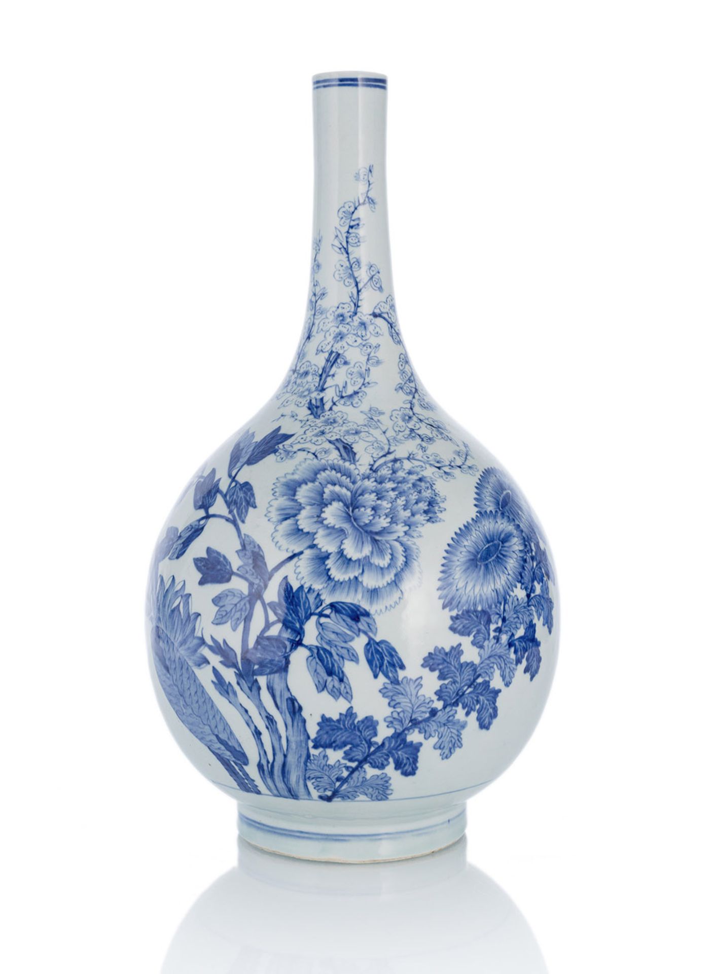 A LARGE UNDERGLAZE BLUE BOTTLE VASE DEPICTING PEONIES, CHRYSANTHEMUMS AND PRUNUS