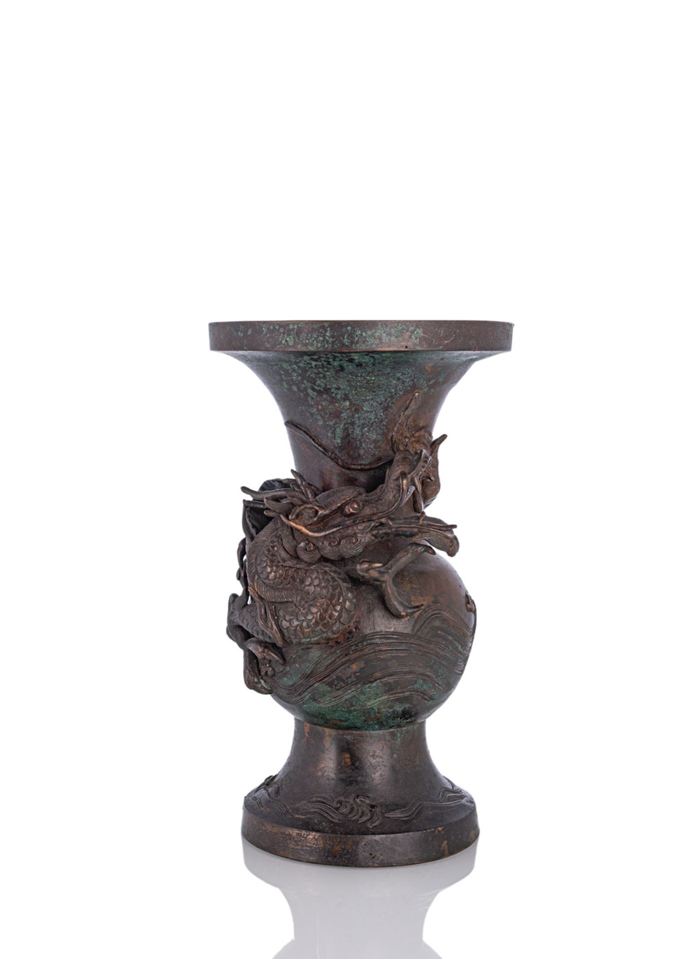 A BRONZE VASE WITH A SCULPTURAL DRAGON OVER WAVES