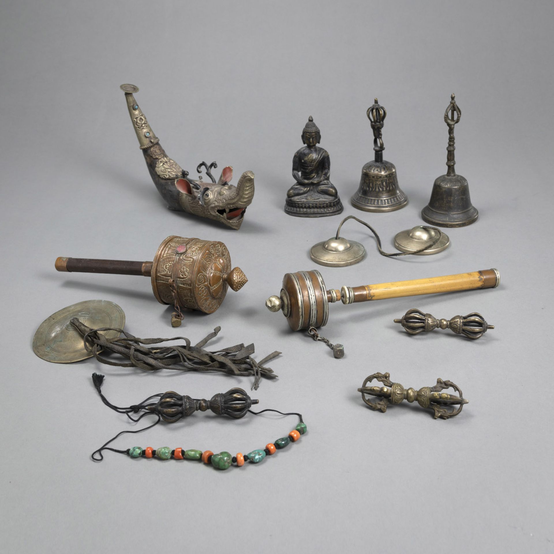 A GROUP OF WORKS OF ART WITH VAJRA, BUDDHA AND UTENSILS