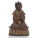 Bronze des Guanyin auf einem Lotus sitzend mit Resten von Fassung und Vergoldung