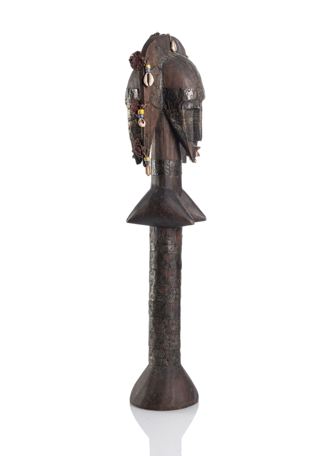 A  FIGURAL WOOD STAFF IN SHAPE OF A WOMAN DECORATED WITH METALL PLACQUES