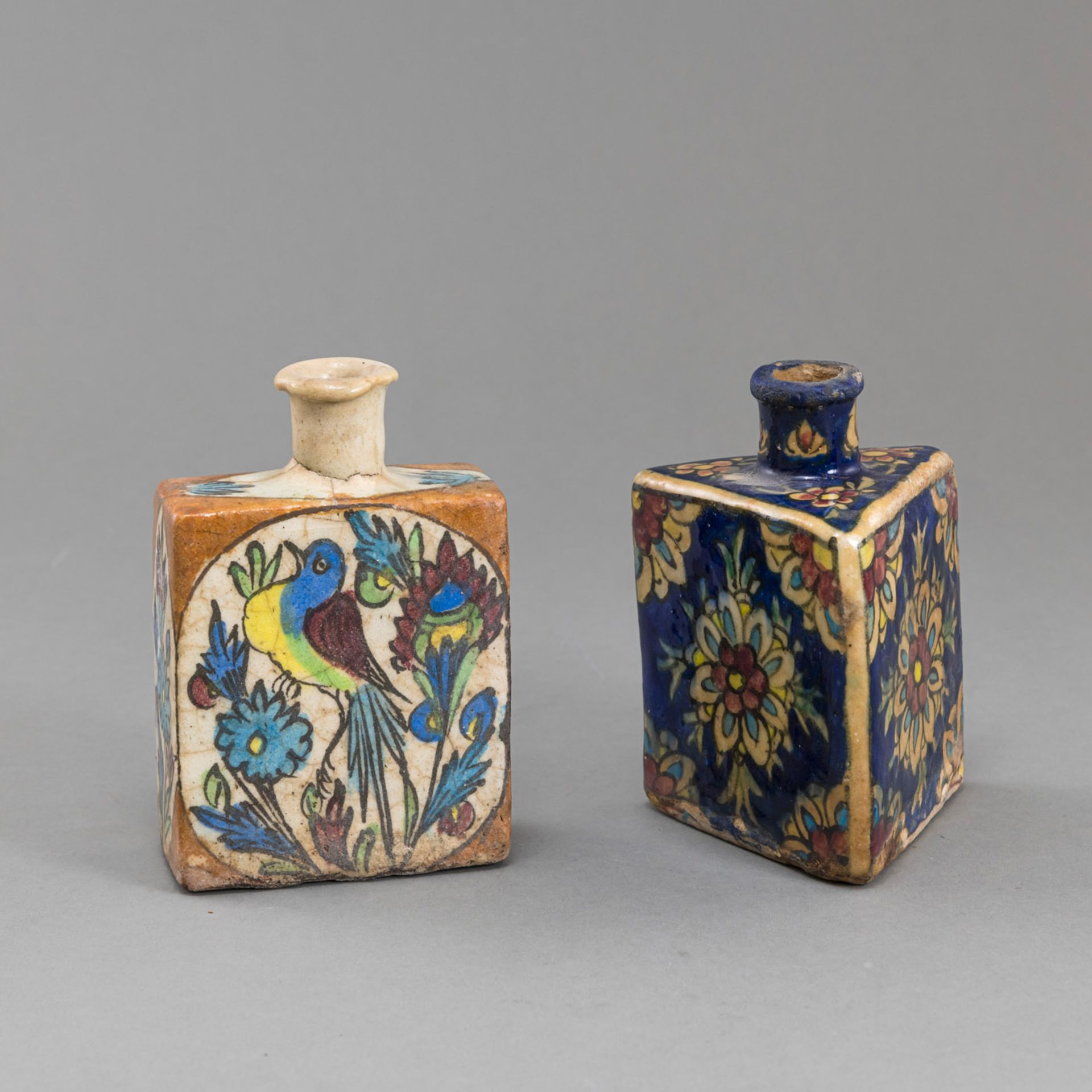 TWO POLYHROME GLAZED POTTERY VASES WITH FLORAL AND ANIMAL DECORATION