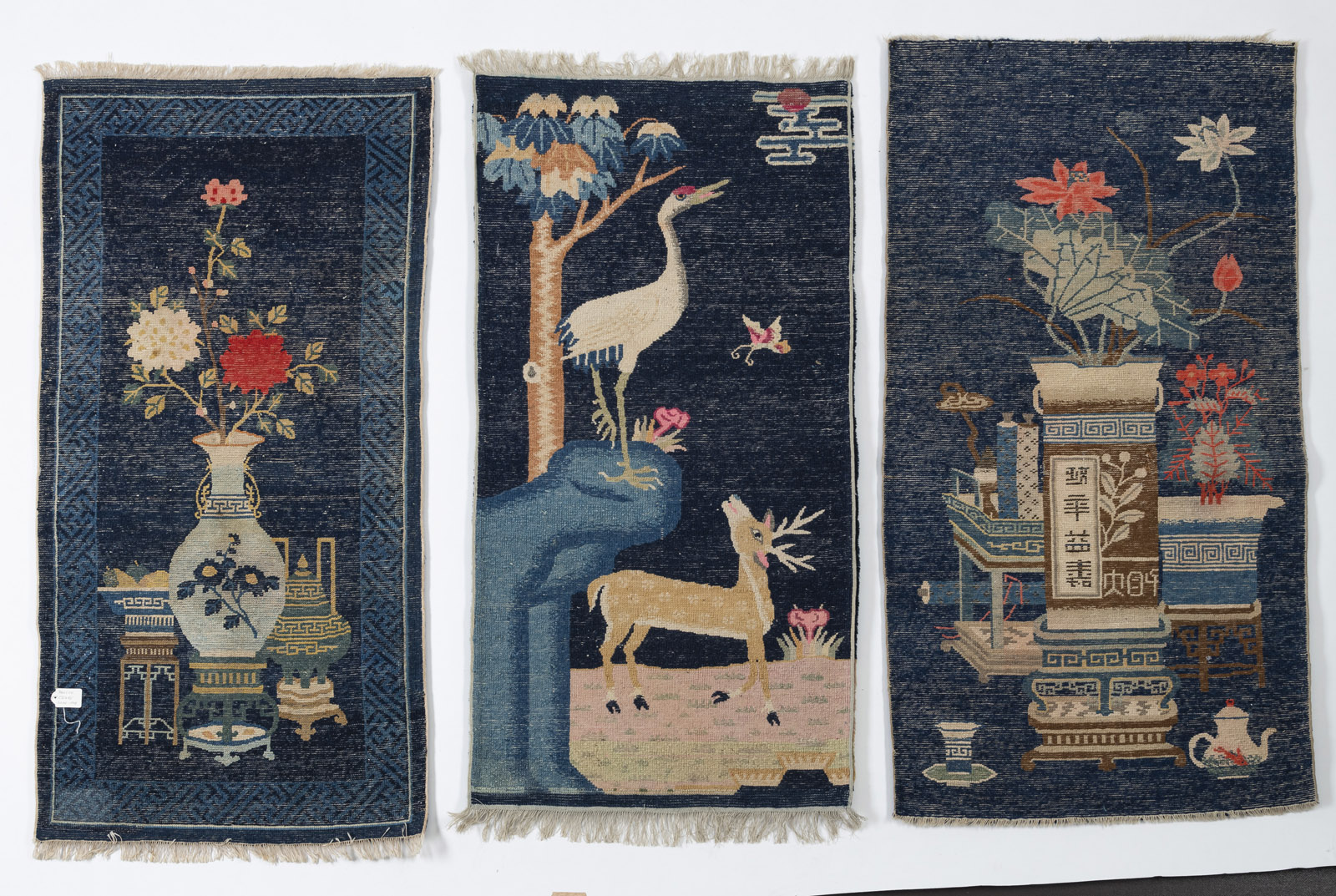 THREE DARK BLUE CARPETS DEPICTING ANTIQUES AND 'CRANE AND DEER' SYMBOLS - Image 9 of 12