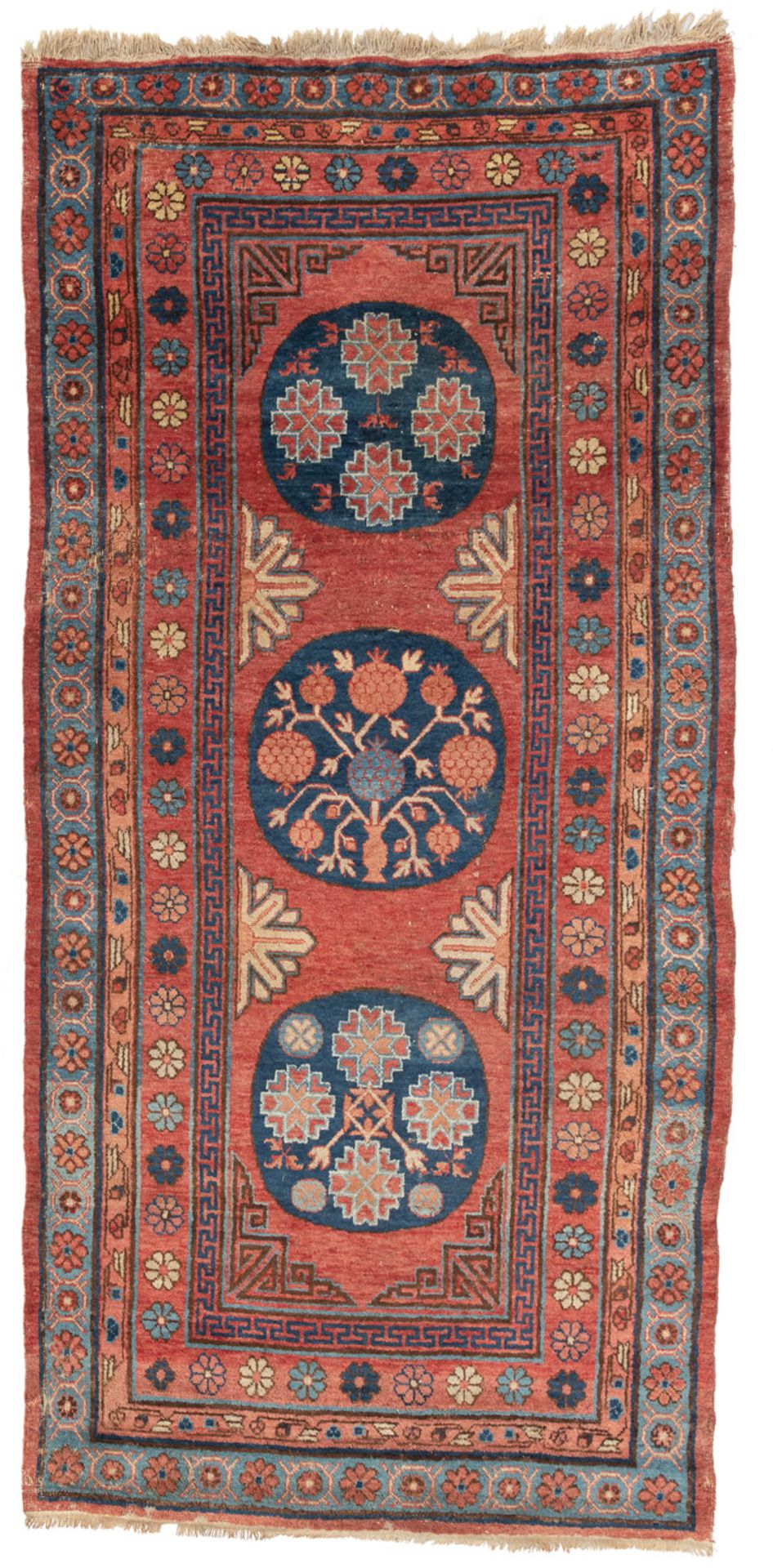 A KHOTAN RUG WITH MEDALLIONS