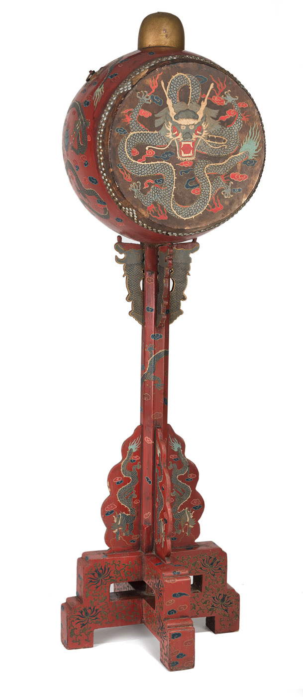 A LARGE DRUM ON A RED-LACQUERED STAND WITH DRAGONS