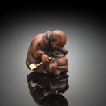 Netsuke des bunbuku chagama aus Buchsbaum