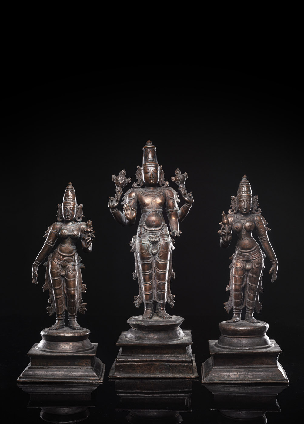 A BRONZE TRIAD OF VISHNU, SRI DEVI AND BHU