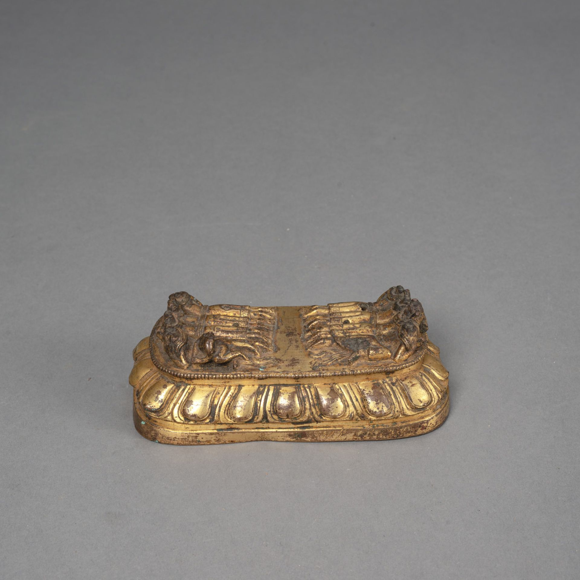 A GILT-BRONZE LOTUS BASE OF A YAMANTAKA