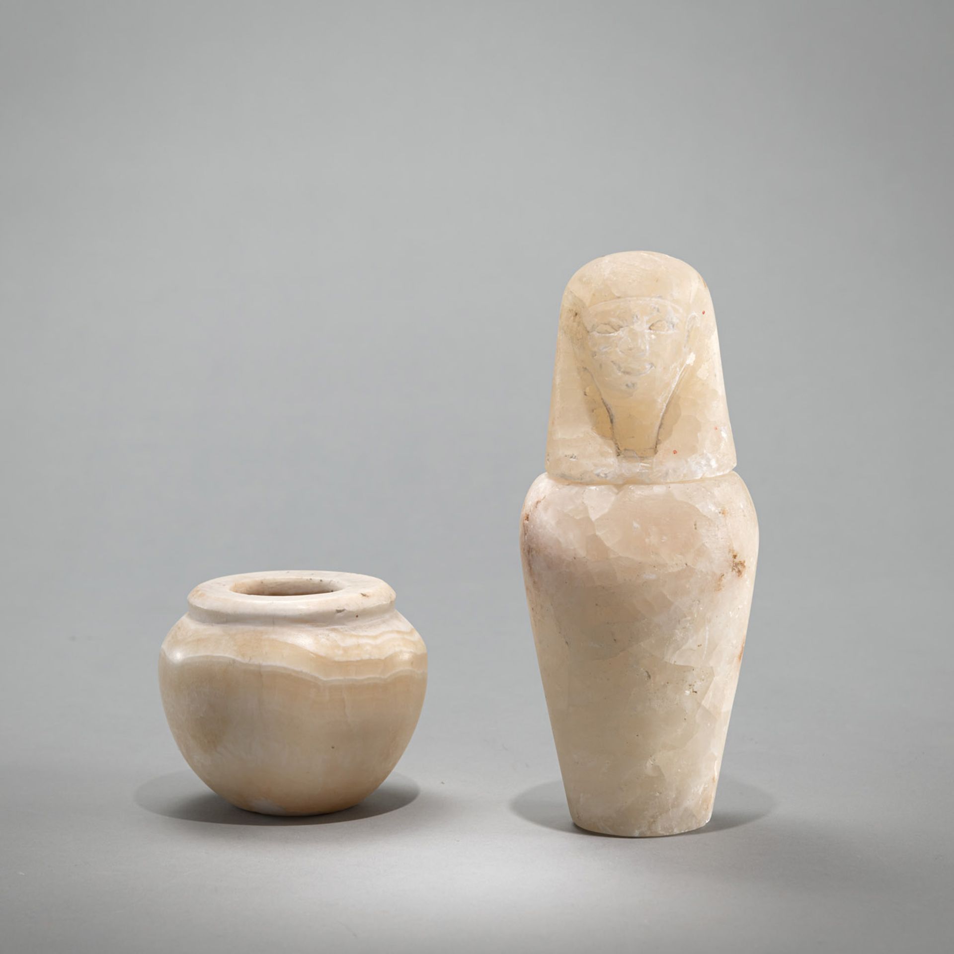 AN ALABASTER JAR AND AN ALABASTER CANOPE