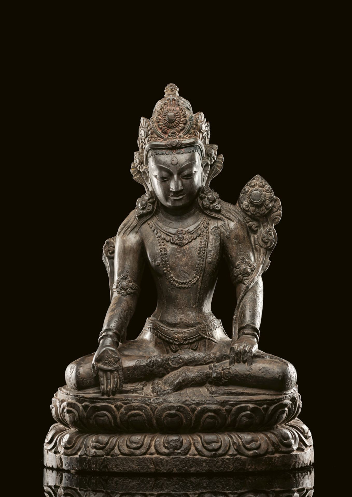 A RARE AND LARGE CARVED STONE FIGURE OF PADMAPANI