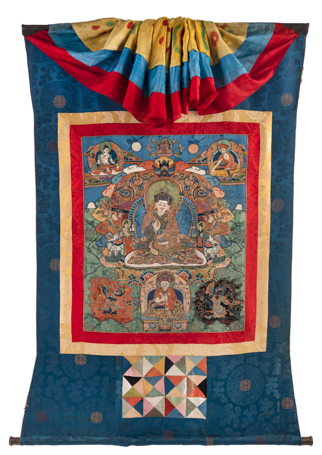 A RARE AND FINE ﻿SILK APPLICATION THANGKA DEPICTING PADMASAMBHAVA