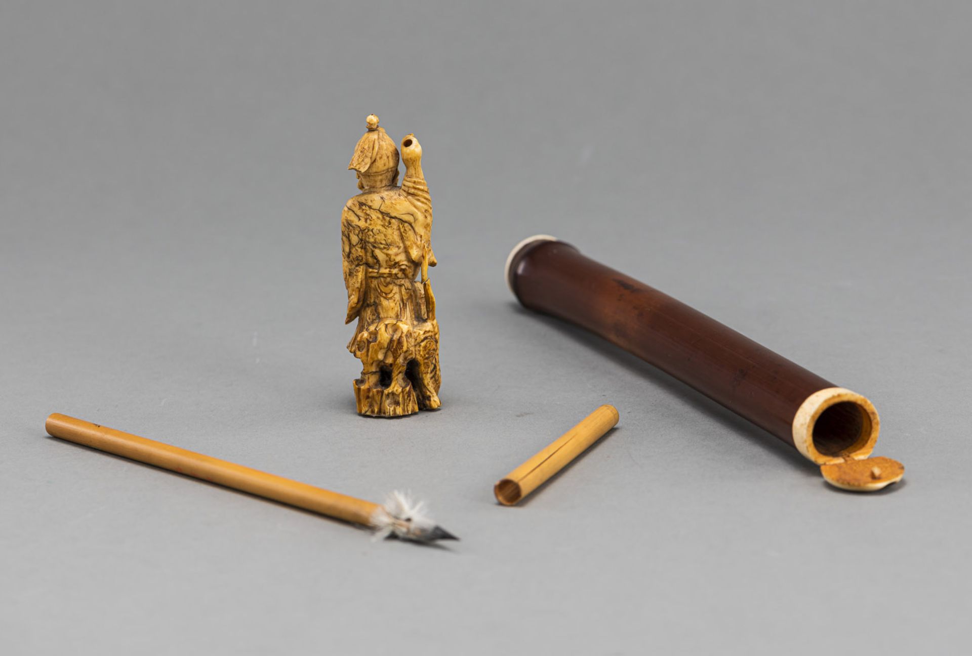 A SMALL DEER HORN CARVING OF BOSHÔ WITH TIGER AND A BAMBOO BRUSH HOLDER WITH BRUSH - Image 2 of 3