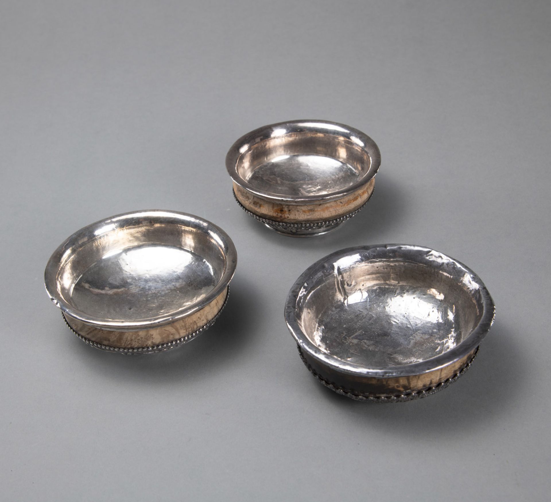 THREE ROOT WOODEN TEA BOWLS (PHORBA), PARTLY MOUNTED WITH SILVER, DECORATED WITH DRAGONS AND BUDDHI - Image 2 of 3