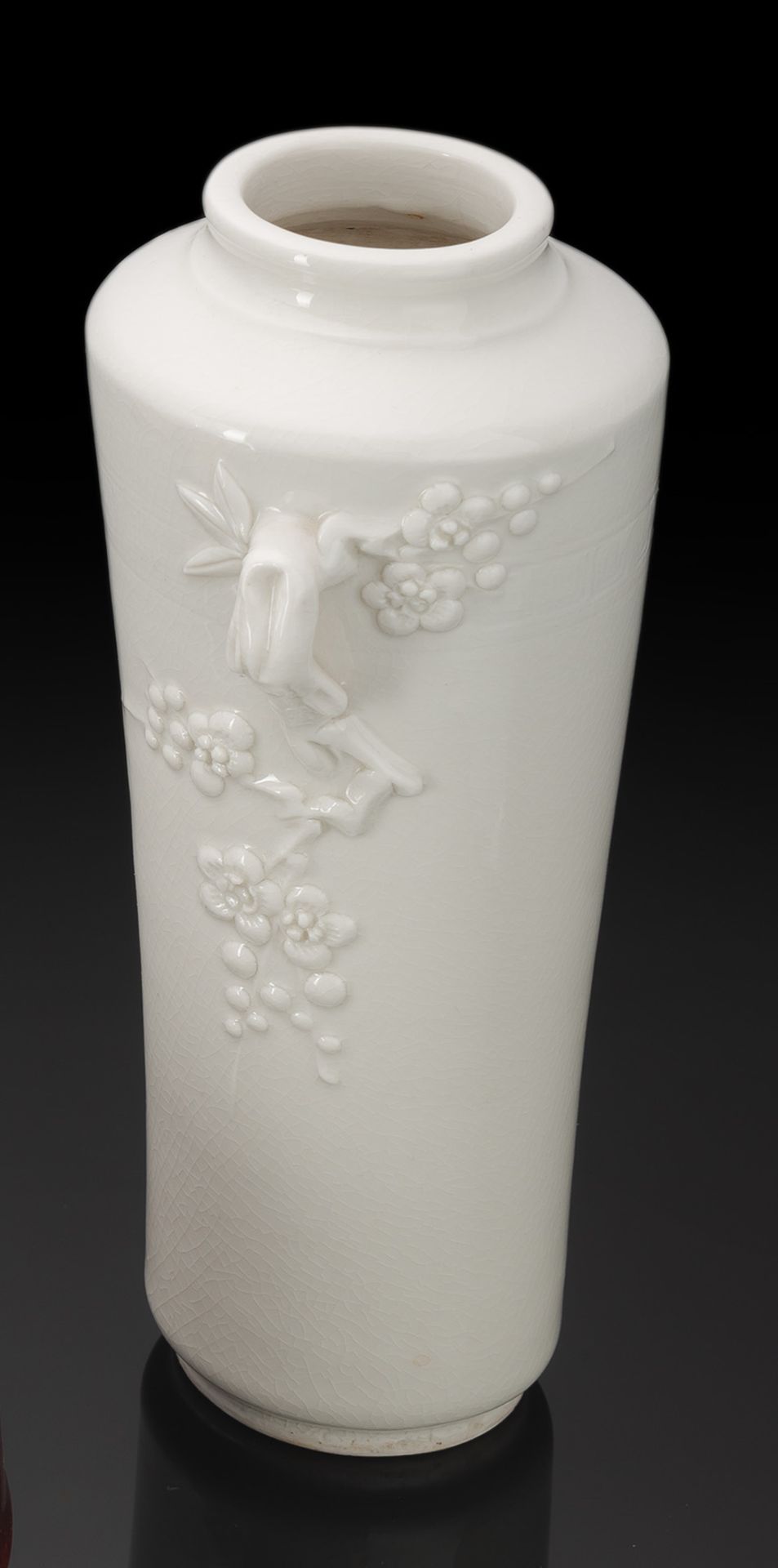 A DEHUA VASE WITH MOLDED PRUNUS BRANCHES AS HANDLES