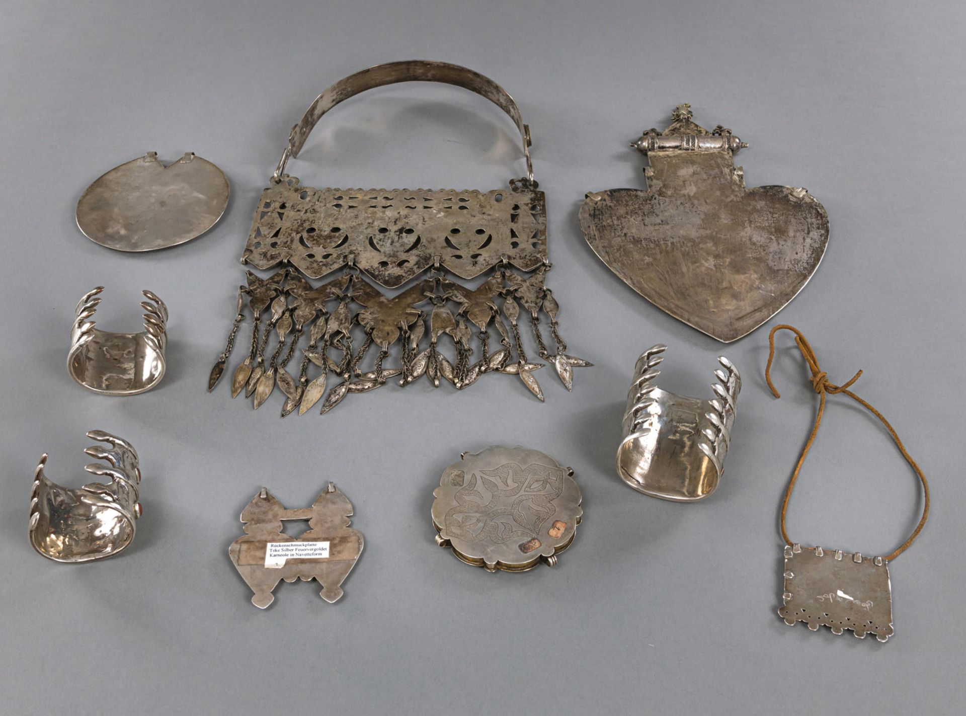 A GROUP OF NINE PIECES OF JEWELRY, INCLUDING BRACELETS, CHEST AND BACK ORNAMENTS, PARTIALLY GILDED  - Image 2 of 2