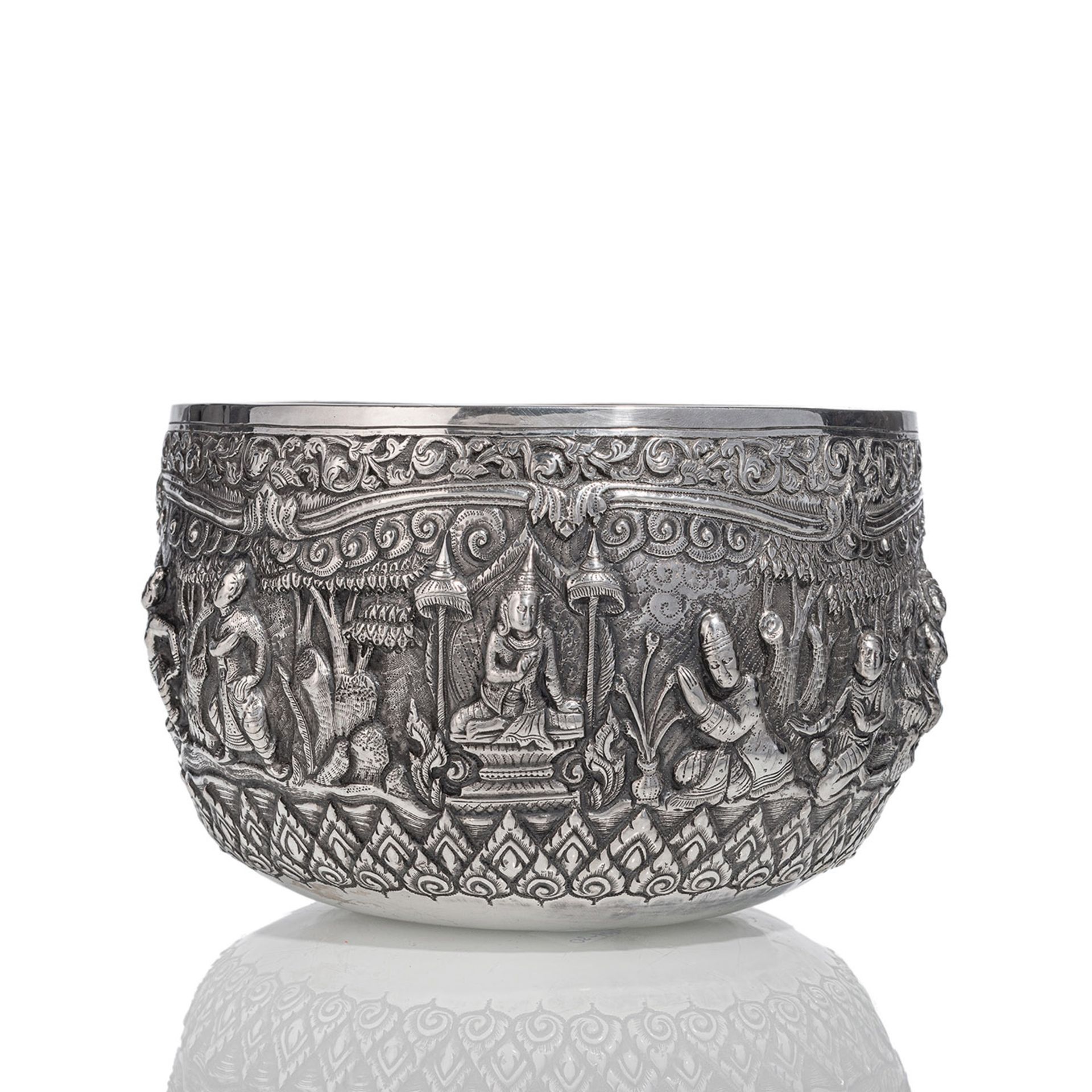 A SILVER OFFERING BOWL WITH FIGURAL SCENES