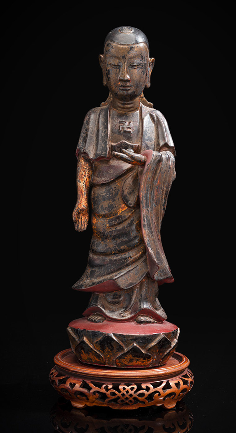 A GILT- AND RED-LACQUERED WOOD FIGURE OF A MONK