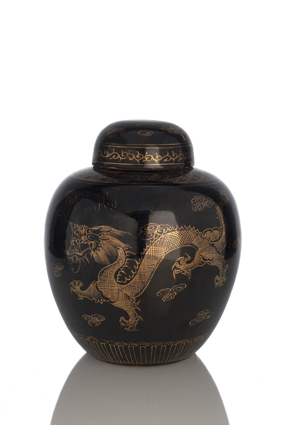 A BLACK-GLAZED GOLDEN DRAGON PORCELAIN VASE AND COVER