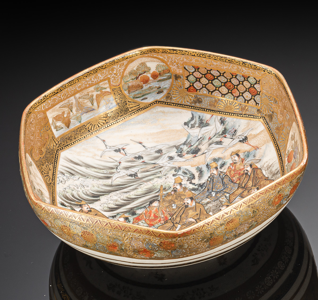 A SATSUMA BOWL WITH A FIGURAL SCENE, FISHER MEN AND CRANES